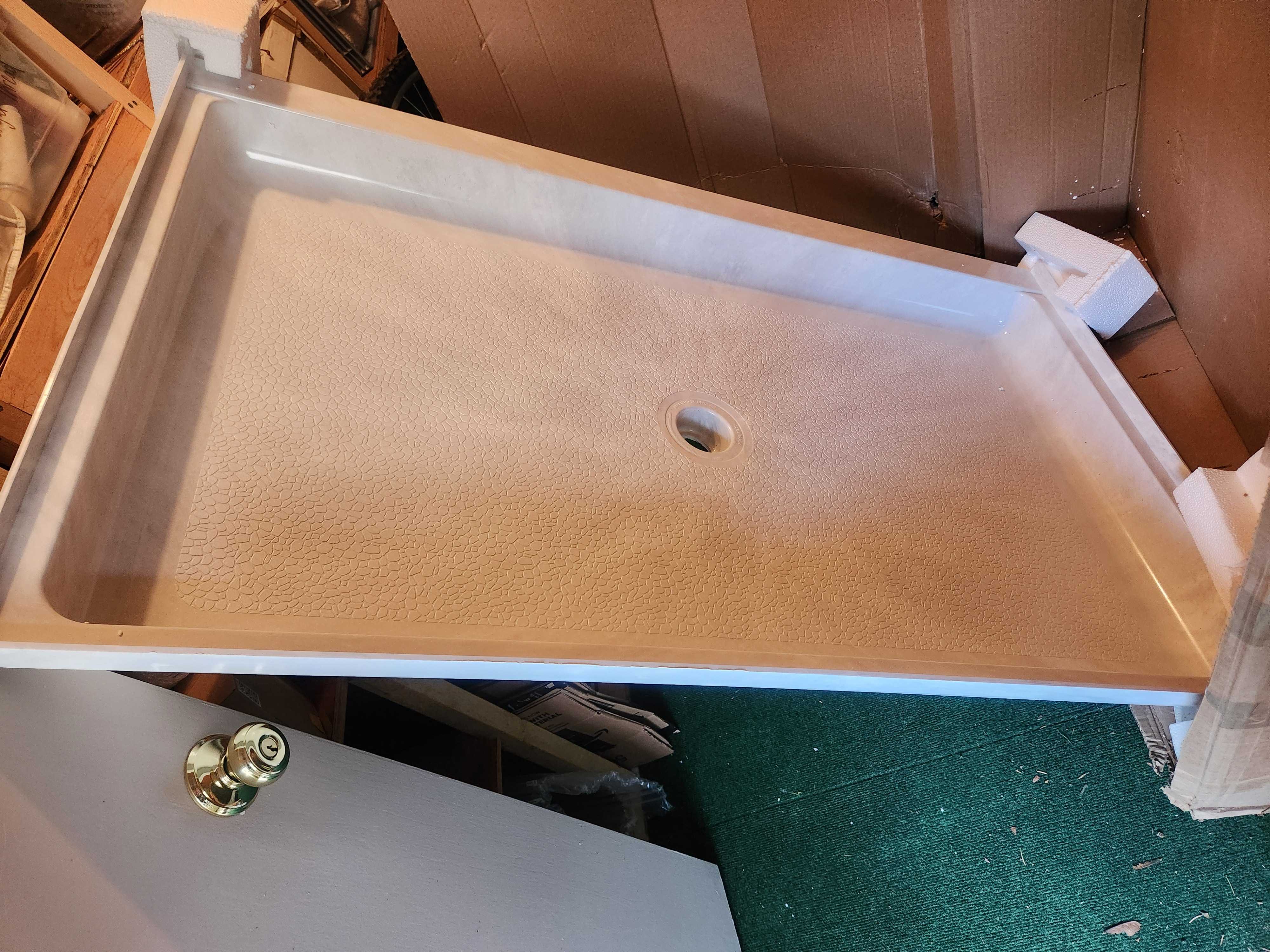 Solid surface shower base