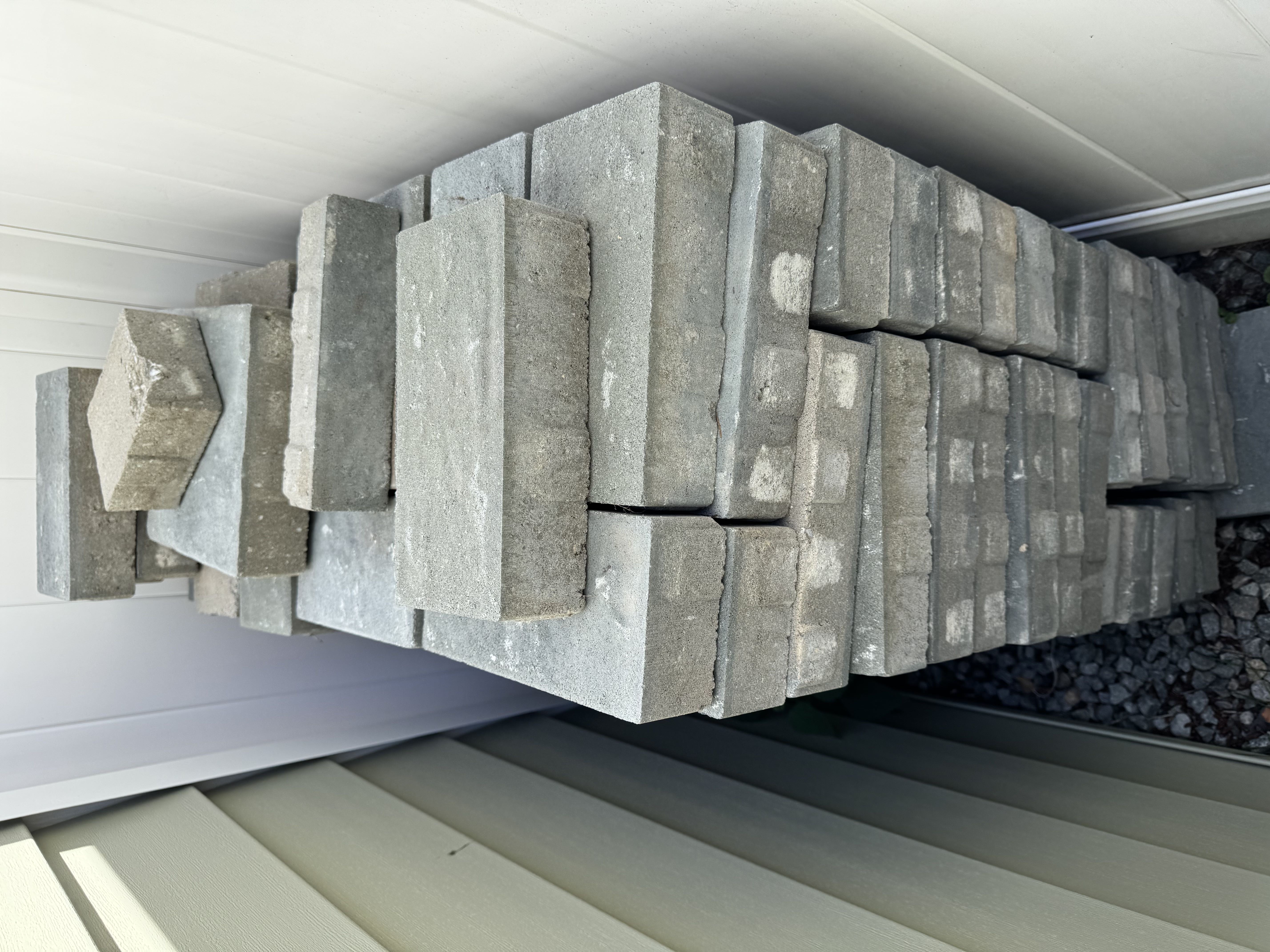 Concrete pave stone each measures 9.5” by 4.5” by 2.5”
