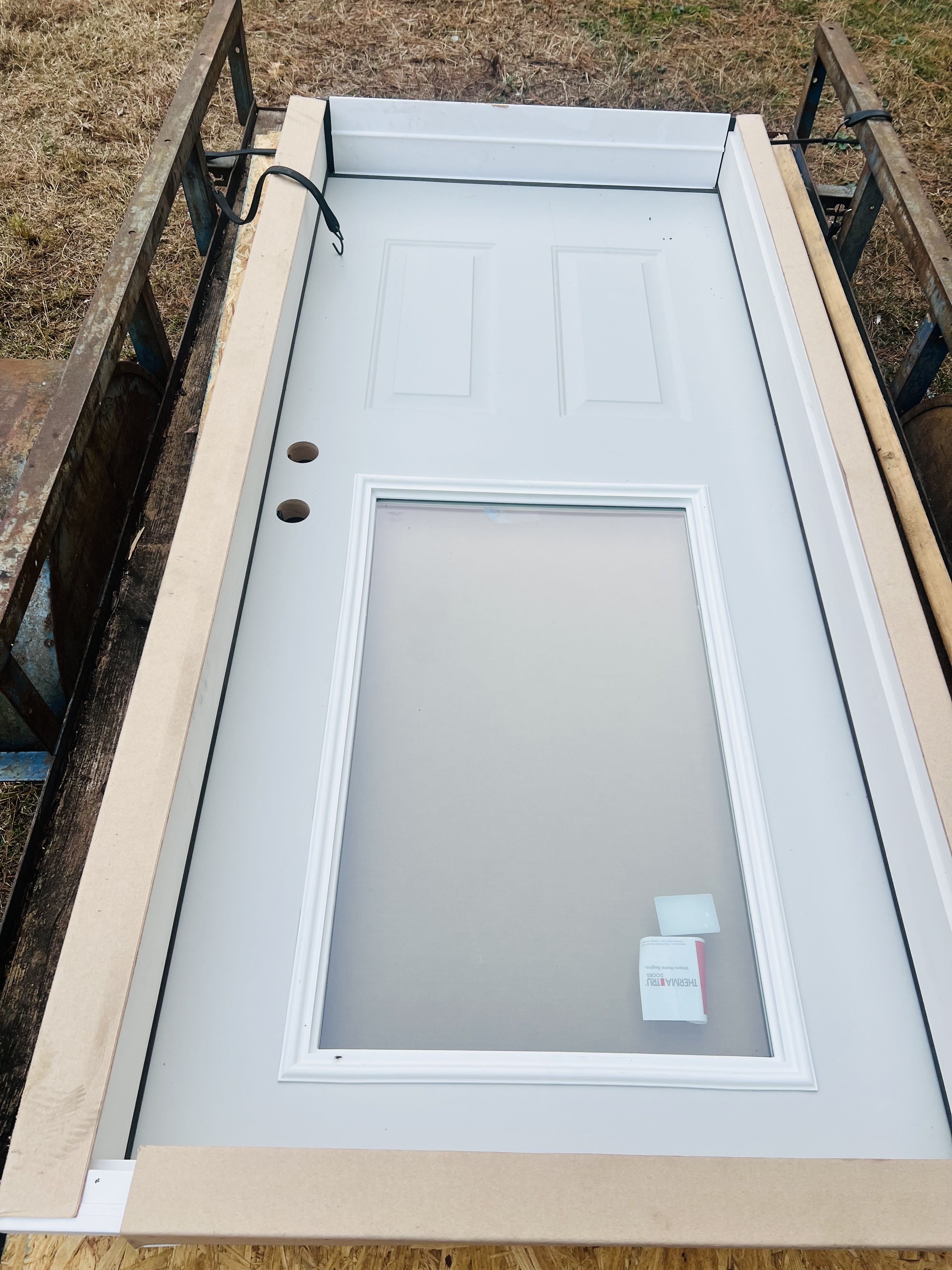Traditions Collection exterior steel door manufactured by Therma-Tru and distributed by Reeb Millwork Corporation for Builders FirstSource. 